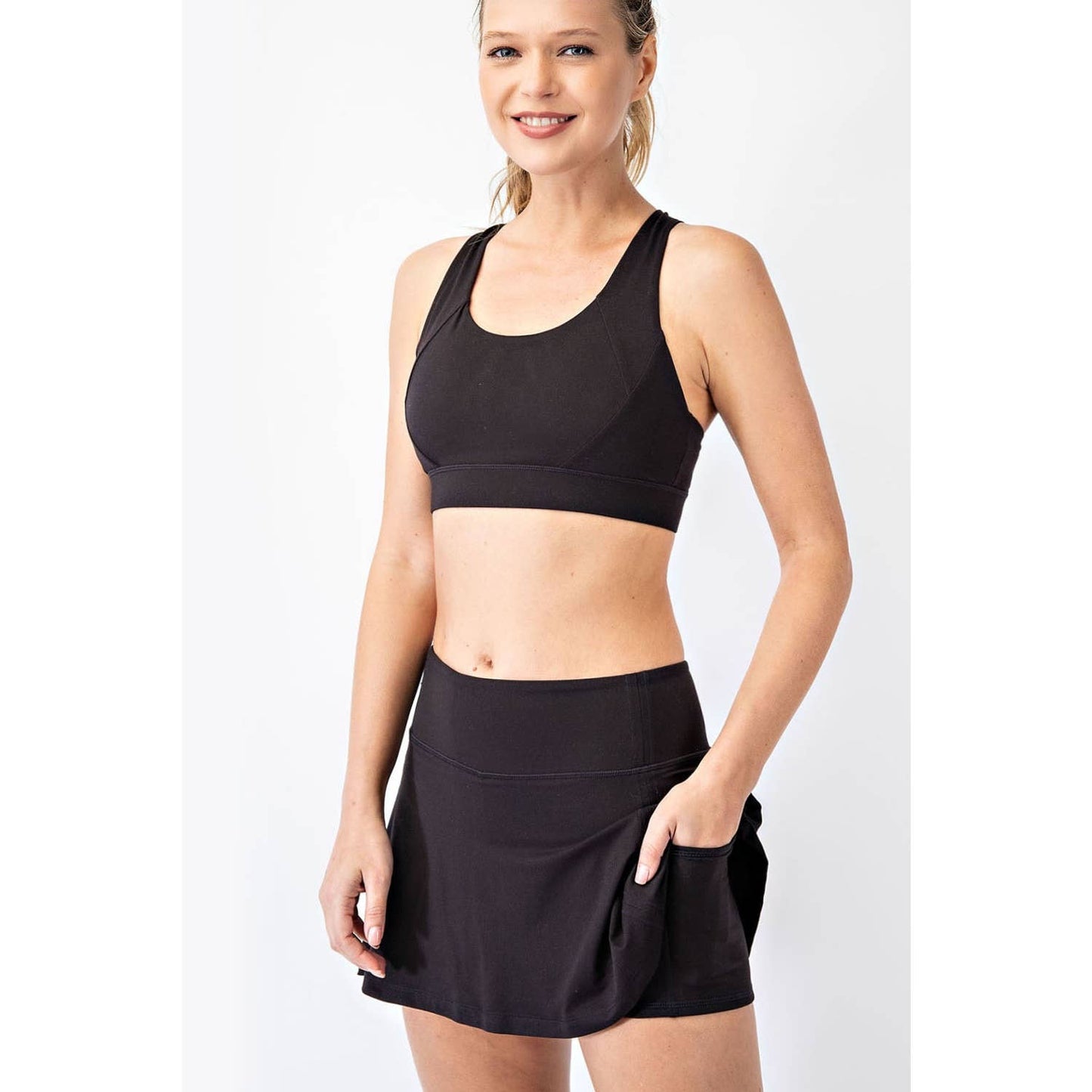 THE MEGAN BACK PLEAT SKORT: Black